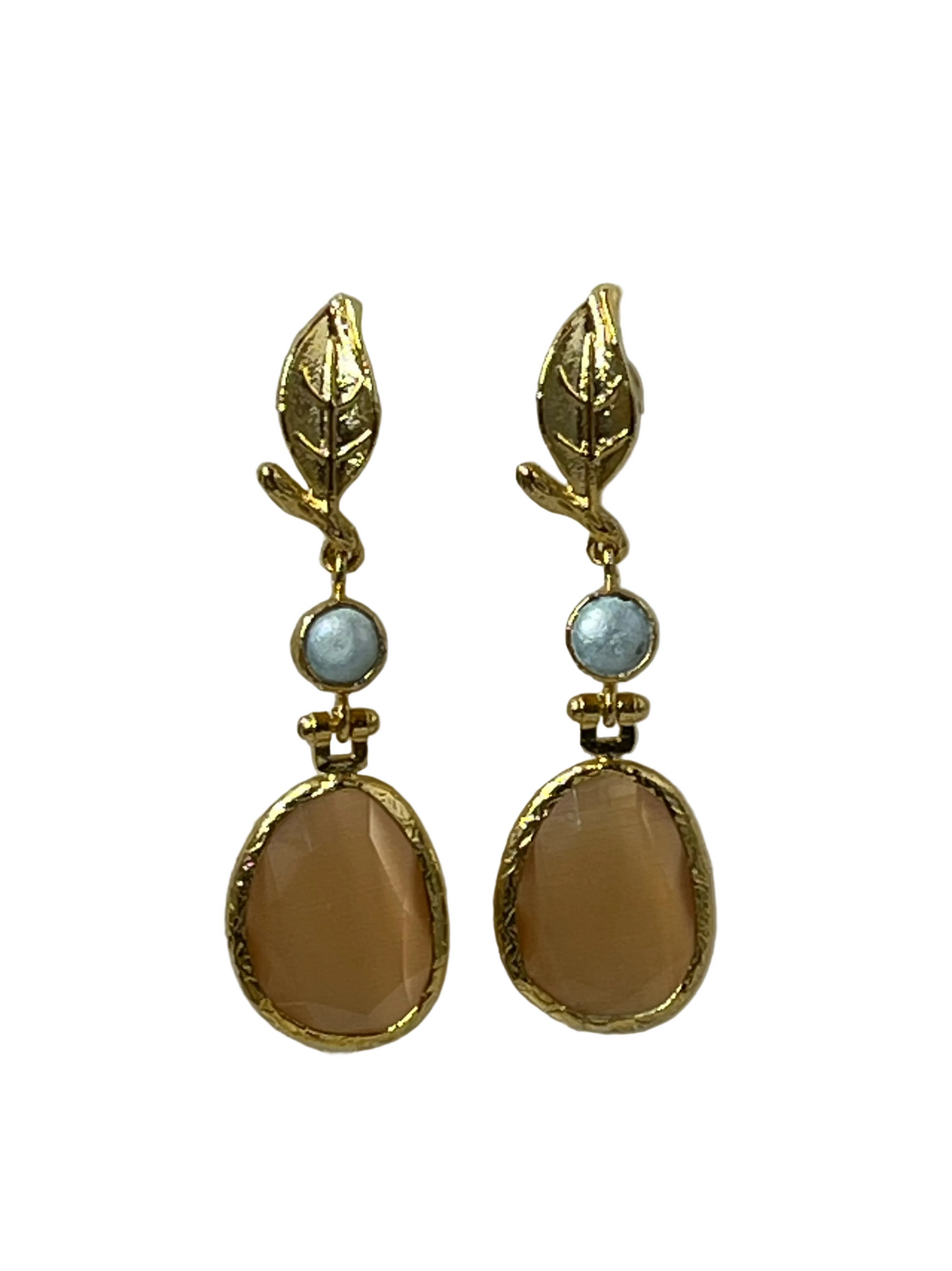 Peach color peblle shape cats eye stones atatched to a tiny fresh water pearl and finished with leafy post.